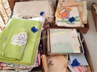 (4) flats of placemats, table cloths, hankies, etc