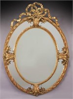 Louis XVI style carved gilt mirror,