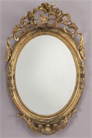 Carved gilt framed oval mirror,
