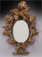 Elaborately carved wood mirror,
