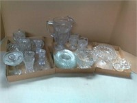 Various clear glass dishes, pitcher, candle +
