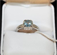 Sky Blue Topaz and Diamond Halo style Ring