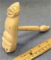 Ivory gavel in the shape of a billiken. The