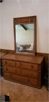3 drawer dresser with a hang on the wall mirror