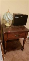 Beautiful wood side table with a lamp, etc