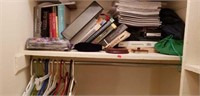 Estate lot of books, note pads, clothes hangers,