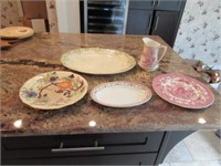 Collection of stoneware platters and pitcher