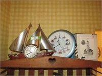 Contents of Shelf:  Lighthouses, Boat Clock, "See