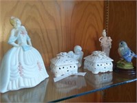 Group of figures and perfume boxes