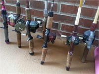 Group of older fish rods and reels