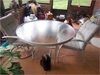 Patio set with glass top table and four chairs