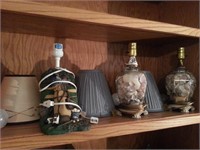 Three small lamps one golf related two with shells