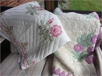 Two large floral patterned quilts