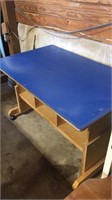 Rolling work table with shelves and blue top