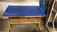Rolling work table with shelves and blue top