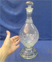 unusual antique decanter on glass base