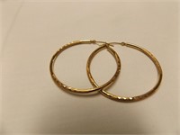 Yellow gold diamond cut hoop earrings