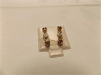 14 kt post earrings with small diamond chip
