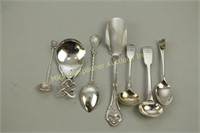 SEVEN ASSORTED STERLING SPOONS AND CHEESE SCOOP