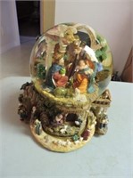 Musical water globe with revolving base
