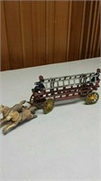 Vintage horse-drawn cast iron toy fire truck