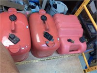 3 portable fuel tanks. 2 are metal with