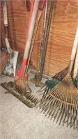 4 rakes and several miscellaneous yard tools