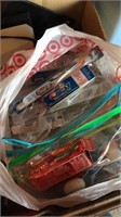 Box of items including toys & toothbrushes