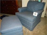 BLUE UPHOLSTERED CHAIR WITH ROLLING OTTOMAN