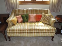 Upholstered loveseat with cherry Queen Anne feet