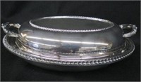 Silver entree dish with divided glass liner