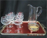 6 wine glasses, wine server, pitcher and a tray