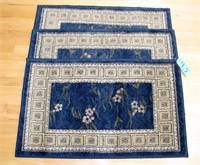 Lot, three matching blue 23"x 37" rugs