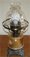Bedside lamp with brass base, clear globe painted