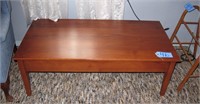 24" x 48" Cherry finish coffee table with two