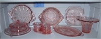 1 Shelf of assorted pink Depression glass