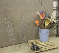 TUB OF SHOVELS AND OTHER GARDEN TOOLS, WITH TOMATO