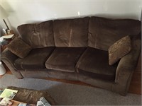 2 Olive green couches and ottoman
