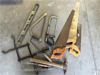 assorted saws/ level/ tongs/ hammer
