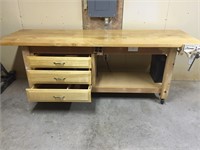 work bench with wheels, vice, and outlets