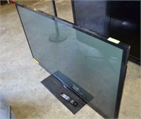 L.G. 60" FLAT SCREEN PLASMA TV ON STAND W/REMOTE