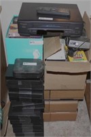 stack of VHS tapes & player