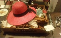 Large flat of old linens and a red sun hat
