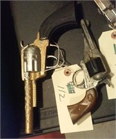 Two old toy cap pistol guns western