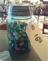 Aqua fruit jar full of old vintage marbles