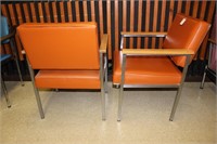 2 orange All-Steel arm chairs