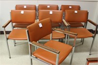 7 burnt orange arm chairs made by Howell