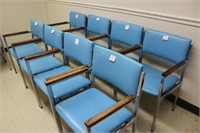 8 light blue arm chairs made by Howell