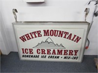 large white mountain advertising sign - electric