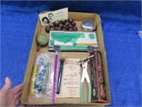 box of old small items: jar sealer -reagan card -